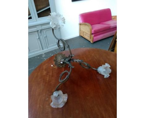 A three arm ceiling light with floral milk glass shades 