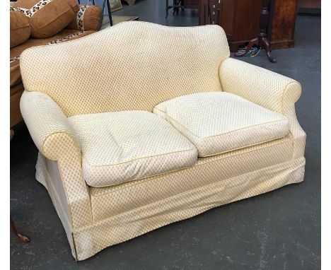 A two seater sofa upholstered in yellow fabric, approx. 143cmW 