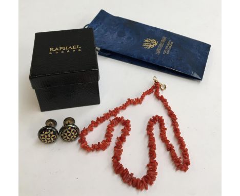 A coral necklace, 48cm long, retailed by Laboratorio Orafo; together with a pair of white metal cufflinks, the reverse impres