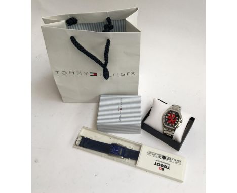 A Tommy Hilfiger watch, mint in box and bag; together with a boxed Tissot watch 