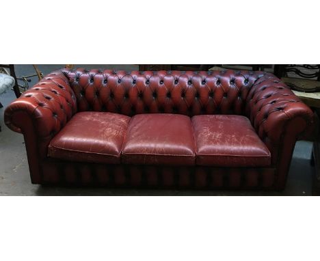 An oxblood vinyl button back chesterfield three seater sofa, approx. 195x84x63cmH
