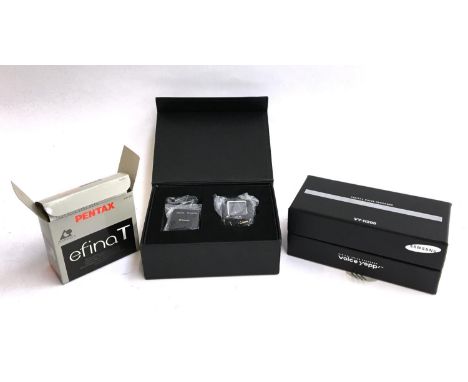 A Pentax Efina T; together with a Samsung Voice Yepp VY-H200 digital voice recorder; a Roadpilot microgo GPS speed warning sy