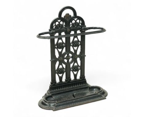 Victorian cast iron umbrella stand, back with pierced tracery design and oval ring guard above a removable drip trayDimension