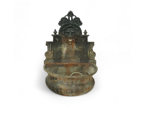 Victorian cast iron ‘lavabo’ lion's head wall fountain, the arched and crested backplate centred with a lion's head spout, wi