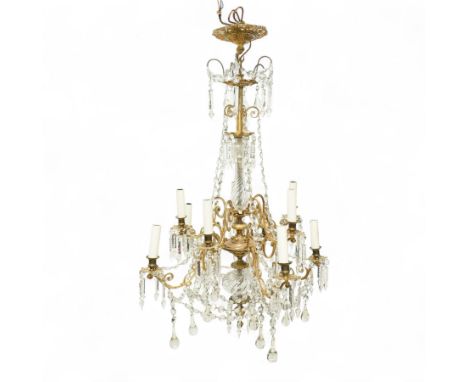 Late Victorian gilt bronze mounted crystal chandelier, ceiling rose above shaped top of trailing swags, glass crystal droplet