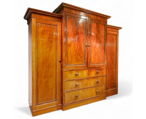 Mid 19th century mahogany breakfront wardrobe, moulded projecting cornice above central section with two gadrooned panelled d