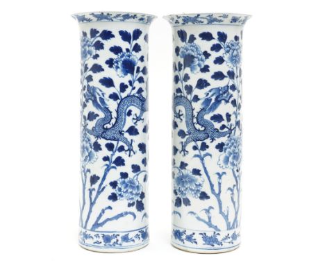 Pair of 19th century Chinese blue and white sleeve vases decorated with four toed dragons and flowering branches, Kangxi mark