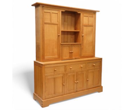 Yorkshire oak dresser, projecting top over open centre fitted with shelf, small double cupboard and flanking full height cupb