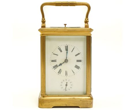 French- late19th century 8-day brass cased carriage clock in a corniche case with carrying handle, four bevelled glass panels