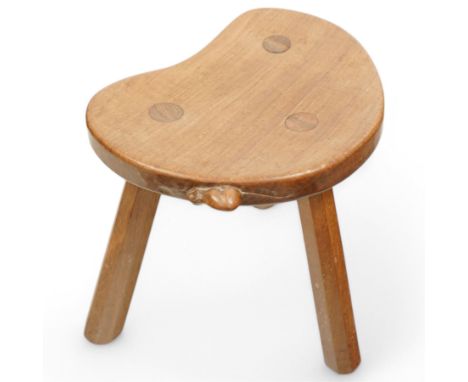 Mouseman - oak three-legged stool, dished kidney-shaped seat on three octagonal splayed supports, carved with mouse signature