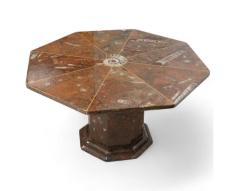 Octagonal specimen table with brass inlay, the limestone tabletop with a central ammonite and orthoceras and goniatite inclus
