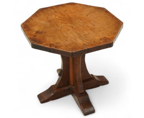 Mouseman - circa. 1930s/40s oak octagonal occasional table, the adzed top decorated with carved scrolls to each corner, cruci