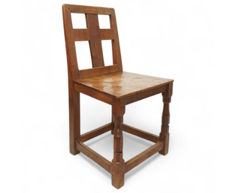 Mouseman - 1930s oak chair, the cruciform back adzed on both sides, over an adzed and figured panelled seat, raised on octago