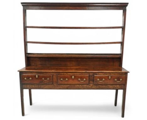 George III oak dresser, upper applied moulding over three tier rack, the dresser base fitted with three drawers with moulded 