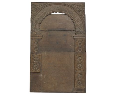 17th Century and later oak panel carved with geometric designs beneath an arch 67cm x 42cm