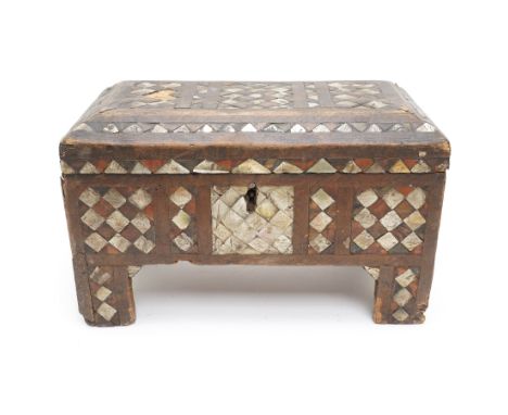 18th century Islamic rectangular casket inlaid with a geometric design with mother of pearl and horn, hinged lid and bracket 