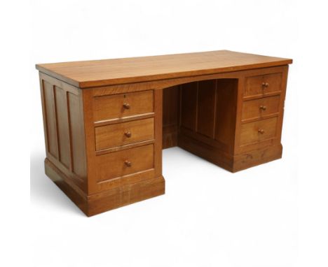 Mouseman - oak pedestal kneehole desk, adzed rectangular top over twin pedestals each fitted with three drawers, arched kneeh