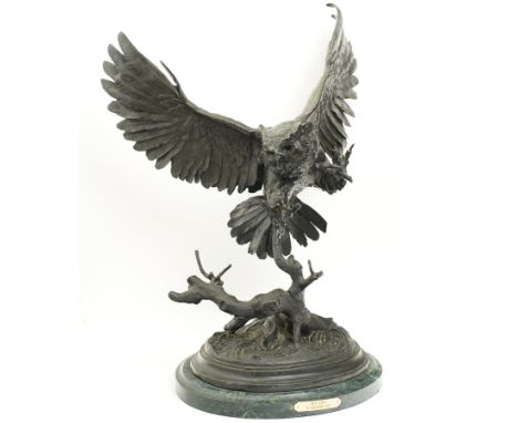 After Jules Moigniez (French 1835-1894): Large bronze sculpture of an Owl with talons outstretched, raised on circular plinth