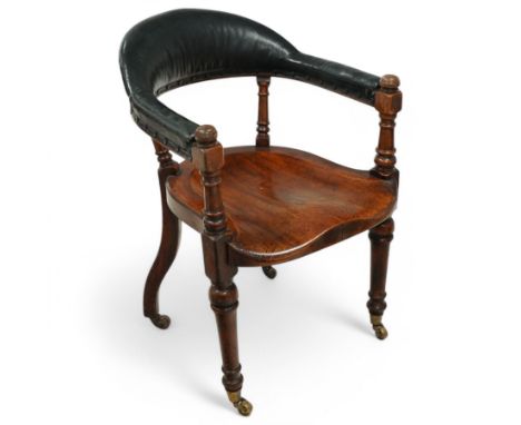 19th century elm and oak desk chair, curved upholstered cresting rail over dished saddle seat, on turned supports with castor