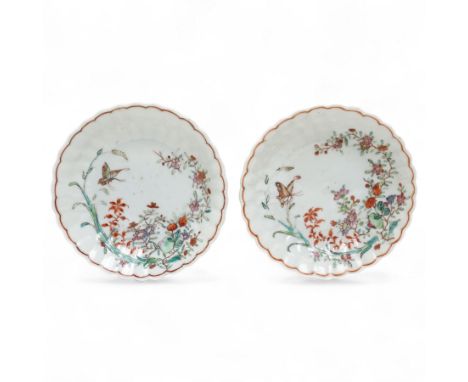 Pair of Chinese Qianlong period soft paste quatrefoil saucers, floral moulded and decorated with butterfly within floral spri