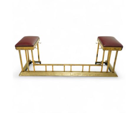 An unusual late Victorian brass club fender, burgundy leather seat pads (recently recovered), inside section with two hooks o