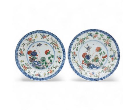 Two Chinese Kangxi period famille verte cafe au lait saucers, decorated with native animals among foliage, with indistinct ma