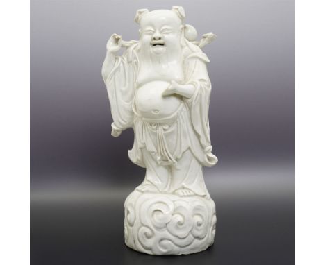 Chinese blanc de chine figure of Shou Lao, standing upon a cloud, H36cm Condition Report:damage to hand, missing all fingers,