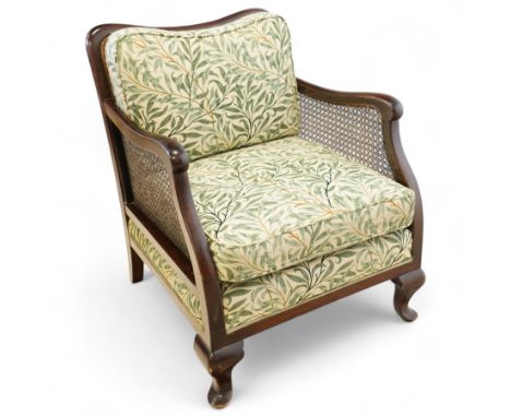 Edwardian stained beech Bergère armchair, with double cane sides and back, with the apron seat and cushion seat and back cush