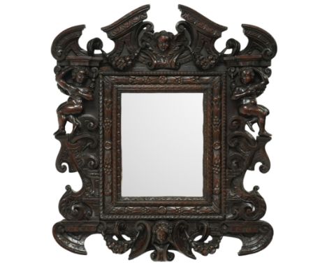 Renaissance-style mid 19th century carved fruitwood wall mirror, carved top surmounted by ‘broken’ arched pediment with centr
