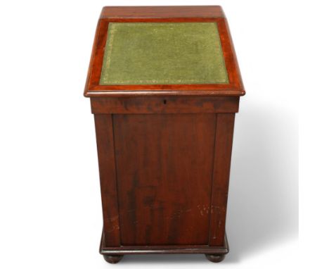 Mid 19th century mahogany davenport with hinged writing slope, interior with four small drawers. Pull out slide and four side