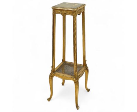 20th century giltwood neoclassical style display stand, square top above carved floral and foliate details, cane shelf above 