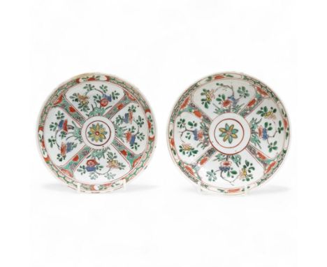 Pair of Chinese Kangxi Dynasty famille verte dishes with floral decoration, with indistinct mark within double rings beneath,