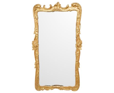 George II giltwood rococo wall mirror, with scroll pediment above acanthus scrolls on gadrooned ground, sides with budding fl