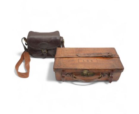Leather six division shotgun cartridge box with the label of James Woodward, London W47cmand a leather cartridge bag 