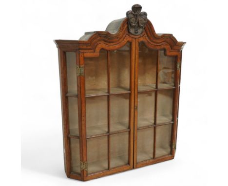 19th century, Louis XV style, oak provincial wall-mounted china cabinet, arched central carved crest motif, with curved asymm