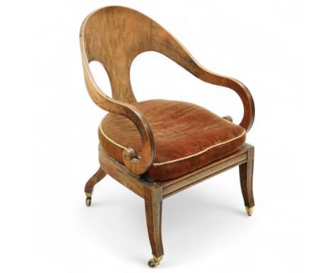 Regency period simulated rosewood 'Roman' style library armchair, arched top rail with scooped back above reeded and down-swe