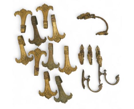 Set of ten late 19th century gilt bronze curtain tie backs with shell and swag design H25cm, five scroll brackets and one oth
