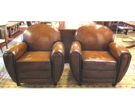 CLUB ARMCHAIRS, a pair, vintage faded tan brown leather and hide upholstered, each with rounded back. (2)