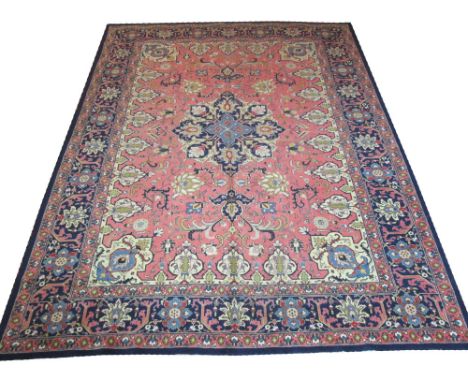 VINTAGE TABRIZ CARPET, 355cm x 260cm, midnight blue pendant medallion on a rose field of scrolling vines and palmettes within