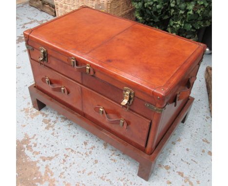 TRUNK, in tanned leather with lift up lid drawer below on wooden stand, 76cm x 46cm x 47cm H. 