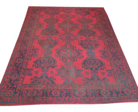 VINTAGE OUSHAK LIBRARY CARPET, 355cm x 280cm, linear stylised organic medallions on a ruby field within corresponding borders