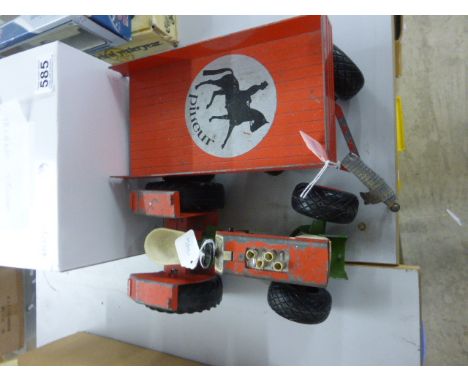 A Bull red tractor and trailer, along with a Triang truck (damaged)