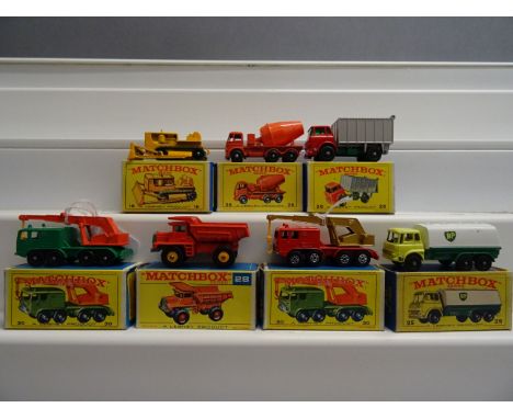 Seven boxed Matchbox 75 Series commercial diecast vehicles to include 18 Caterpillar Bulldozer, 25 BP Tanker, 26 GMC Tipper T
