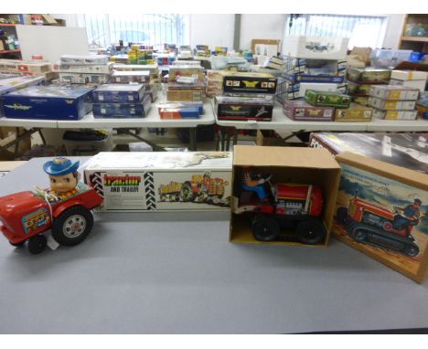 Three farming related tin plate and plastic toys to include boxed Kovap Tractor and Trailer, boxed MS356 Tractor made in Chin