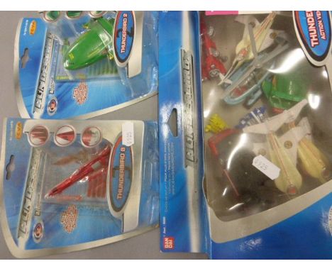 10 Boxed Thunderbirds vehicles, toys and games to include Bandai Deluxe Thunderbird 2, Parker Monopoly, etc