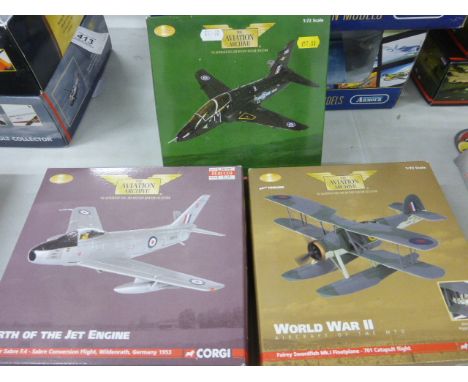 Three boxed Corgi The Aviation Archive 1:72 planes to include RAF Trainers AA36003, World War II AA36303 and Birth of the Jet