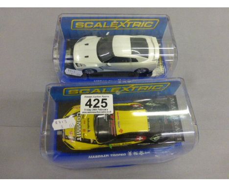Two cased Scalextric digital DPR slot cars to include Maserati Trofeo & Nissan GT-R