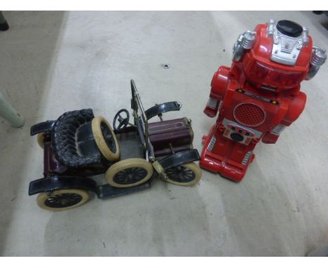 A JBN tinplate car, along with a Dinky Studebaker, model 172, a model robot and a model tin ship on wheels 