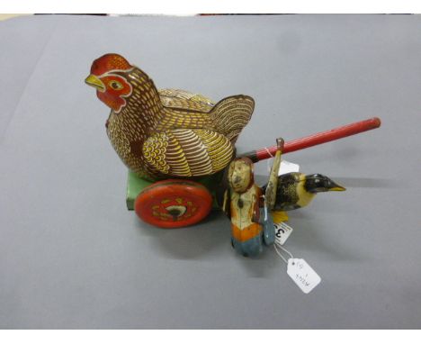 1950's Brimtoy tin plate walking penguin with key plus a vintage tin plate monkey and tin plate push-a-long chicken made in G