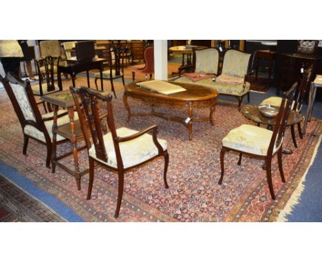 A late Victorian mahogany parlour suite, comprising of sofa, two armchairs and four side chairs, each with serpentine top rai